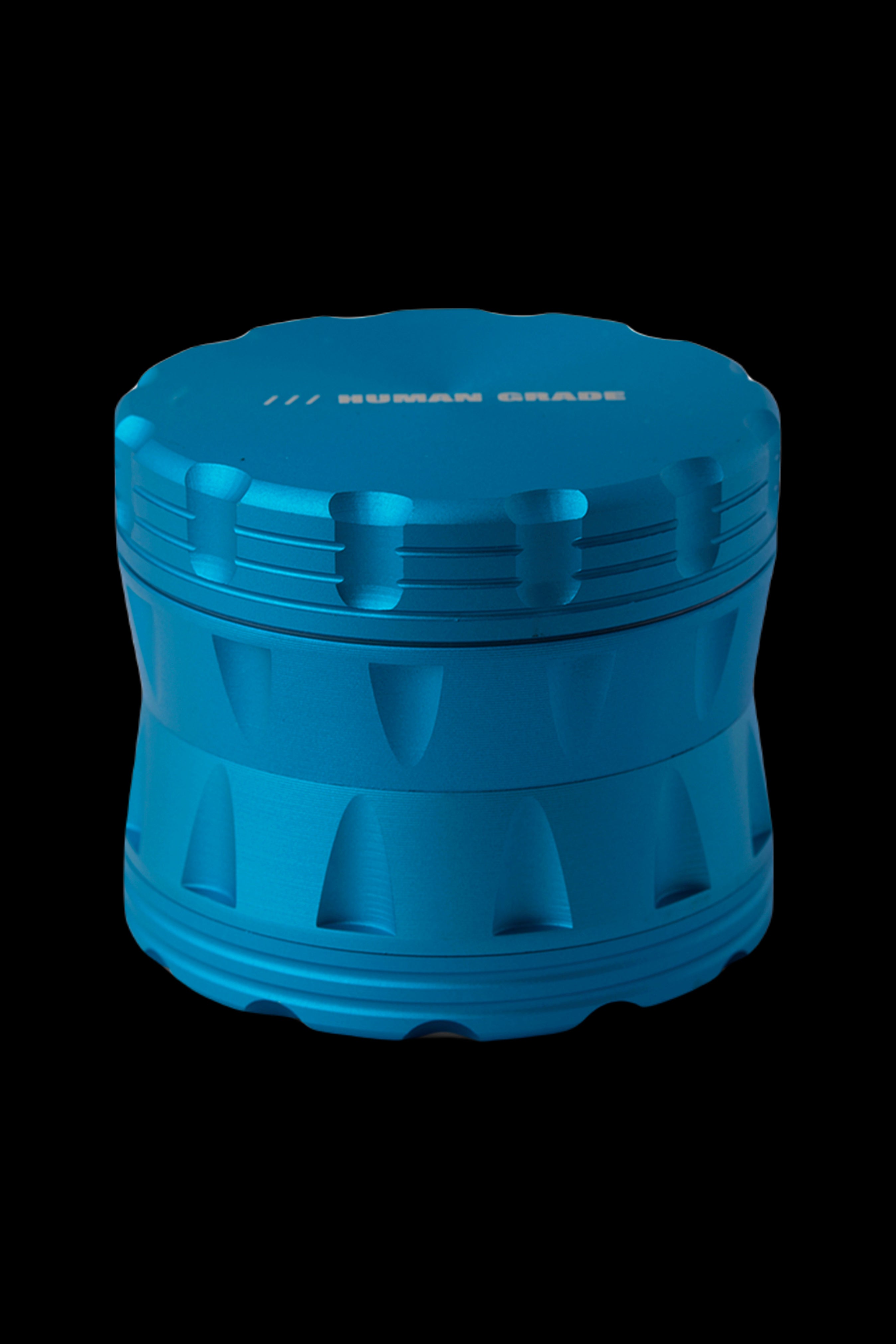 Blue four-piece cannabis grinder with textured grip.