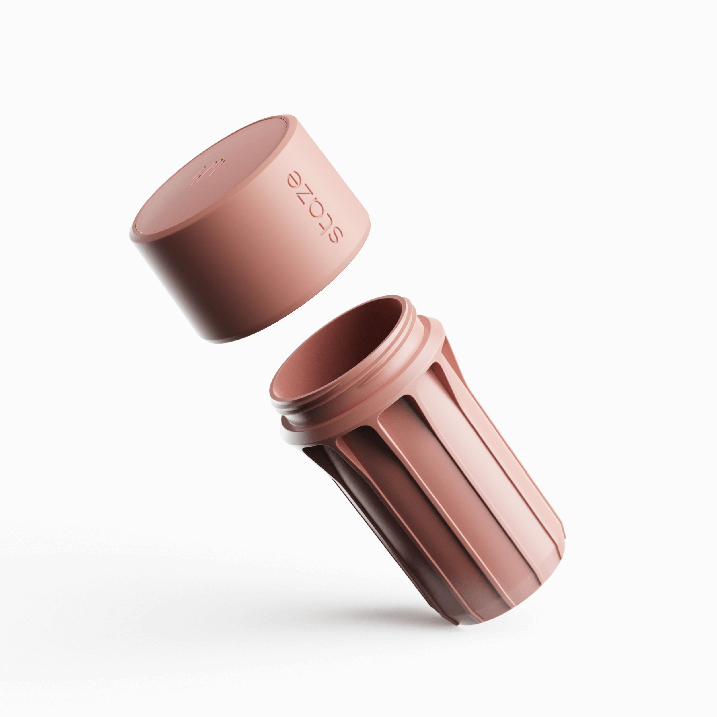 Angled close-up of the rose‑gold STAZE PRESERVE cap and threaded body suspended on a white background