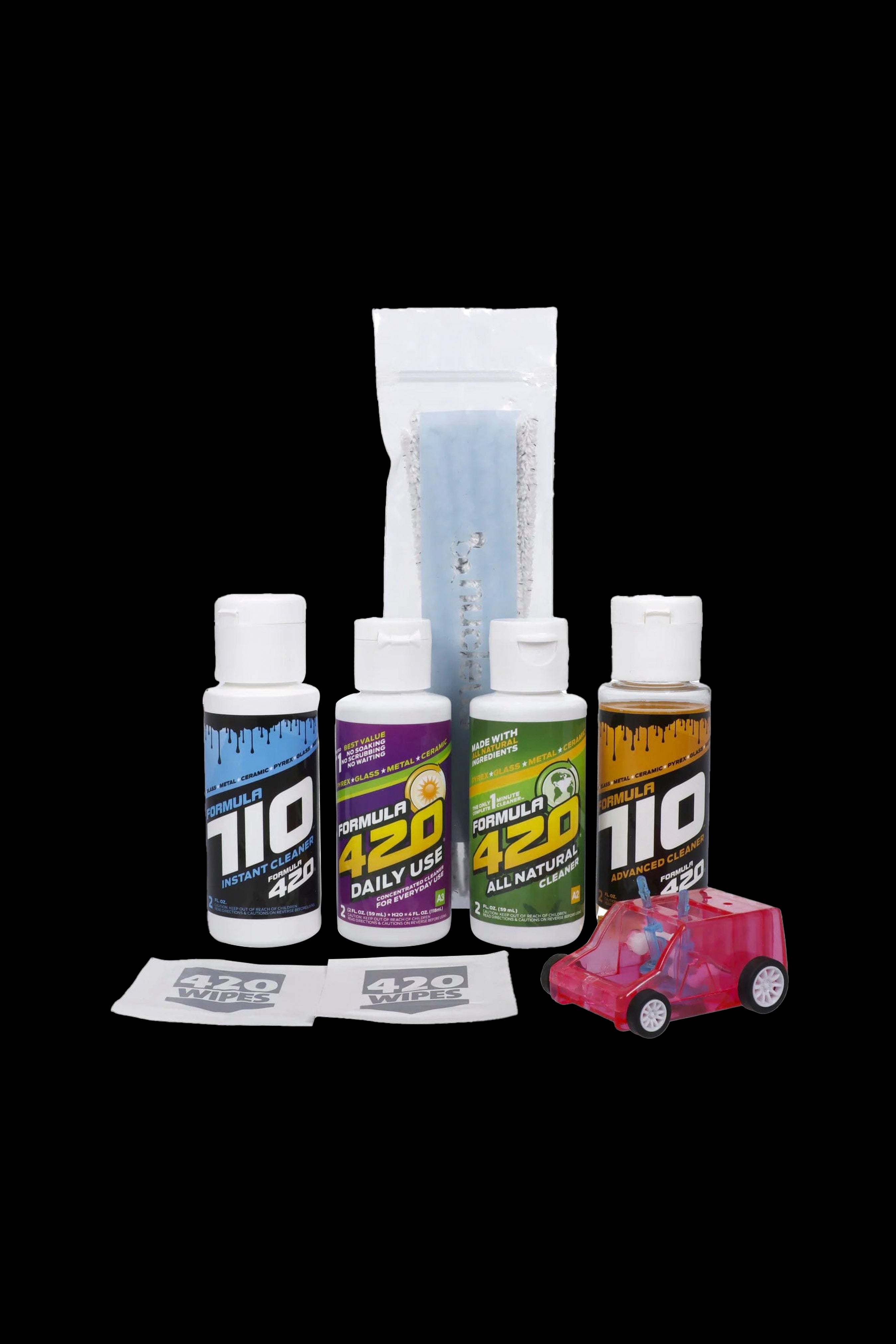 Product shot of Formula 420 cleaning solutions, wipes, and a small spray bottle, arranged on a black background.