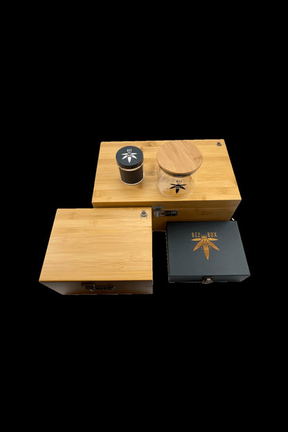 Wooden cannabis storage box with branded jars and sliding drawers.