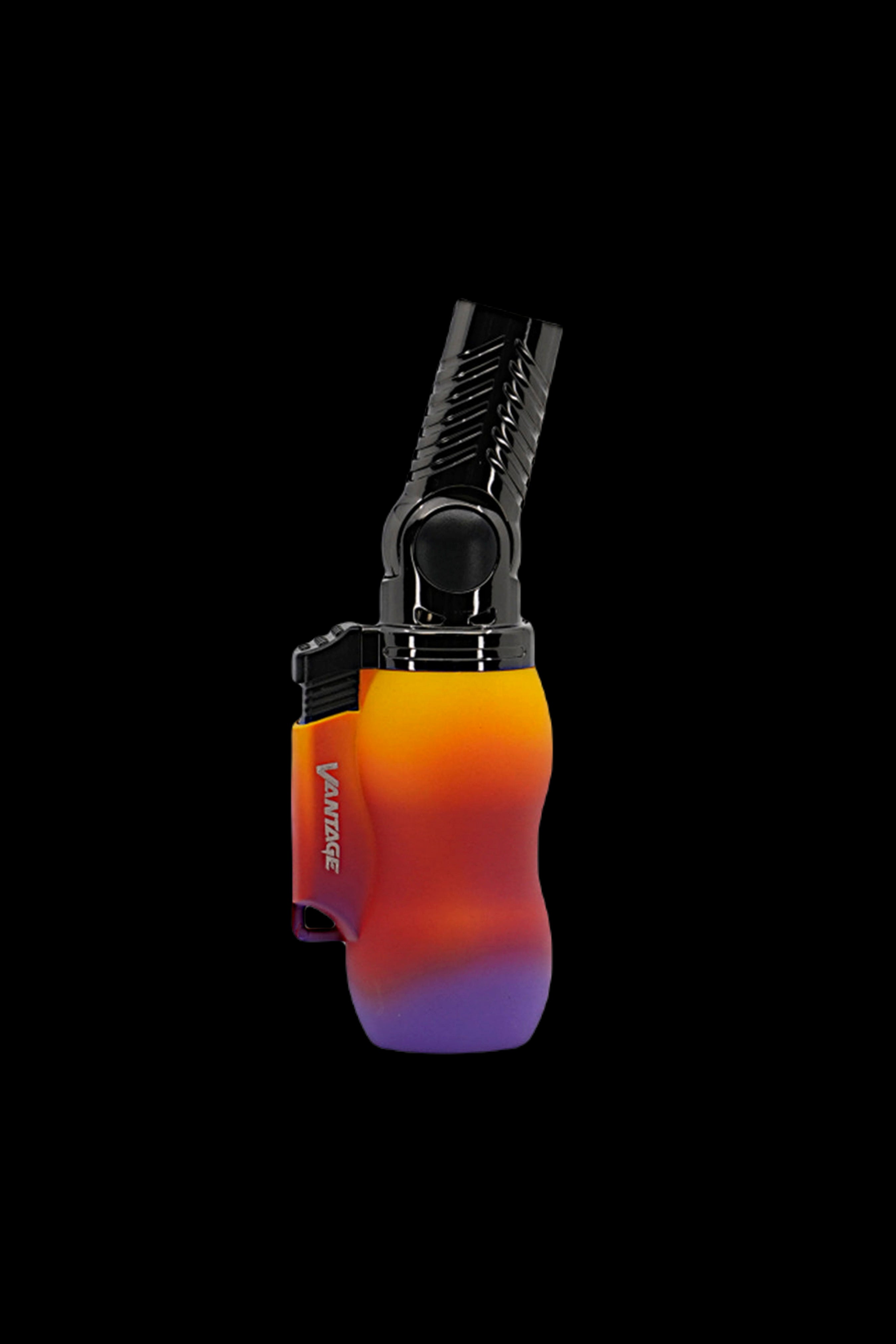Colorful butane torch lighter isolated on black.