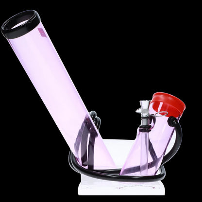 A translucent lavender glass bubbler with black accents and a red mouthpiece, resting on a white marble base.