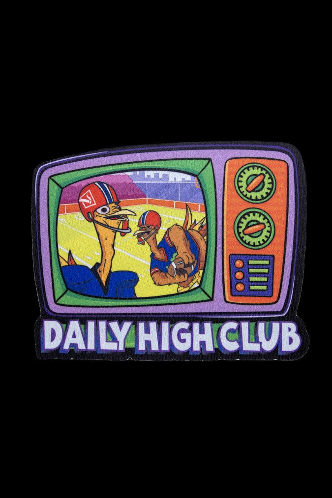 Retro television patch depicting a dinosaur referee signaling a dinosaur football player, with "DAILY HIGH CLUB" text below.