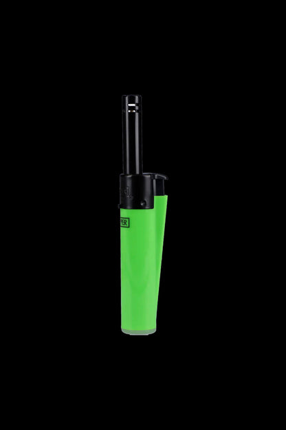 Green butane lighter isolated on a black background.