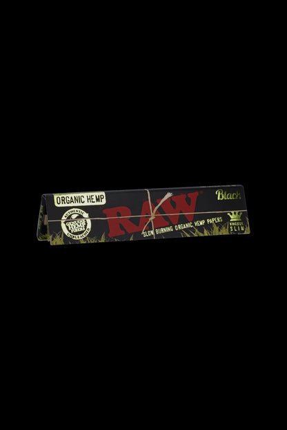 Pack of RAW Organic Hemp rolling papers against a black background. <start_of_image>