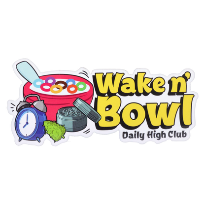Sticker-style graphic showing a red cereal bowl, blue alarm clock, green grinder and bud beside bold yellow text reading “Wake N’ Bowl” Smoking Box.
