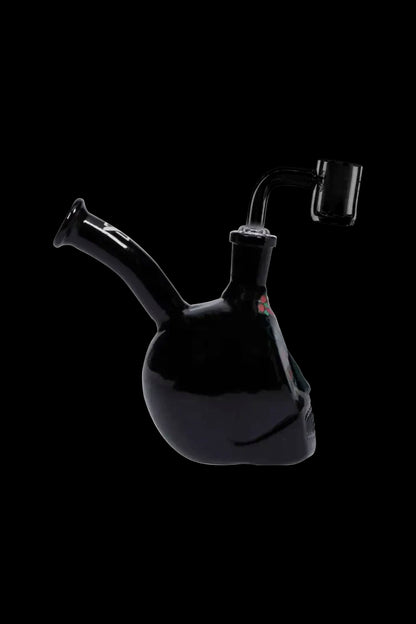 Black glass water pipe with floral design and accompanying glass bowl.
