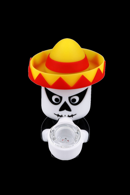 Day of the Dead-themed cannabis pipe with a white skull wearing a yellow sombrero and a glass bowl.