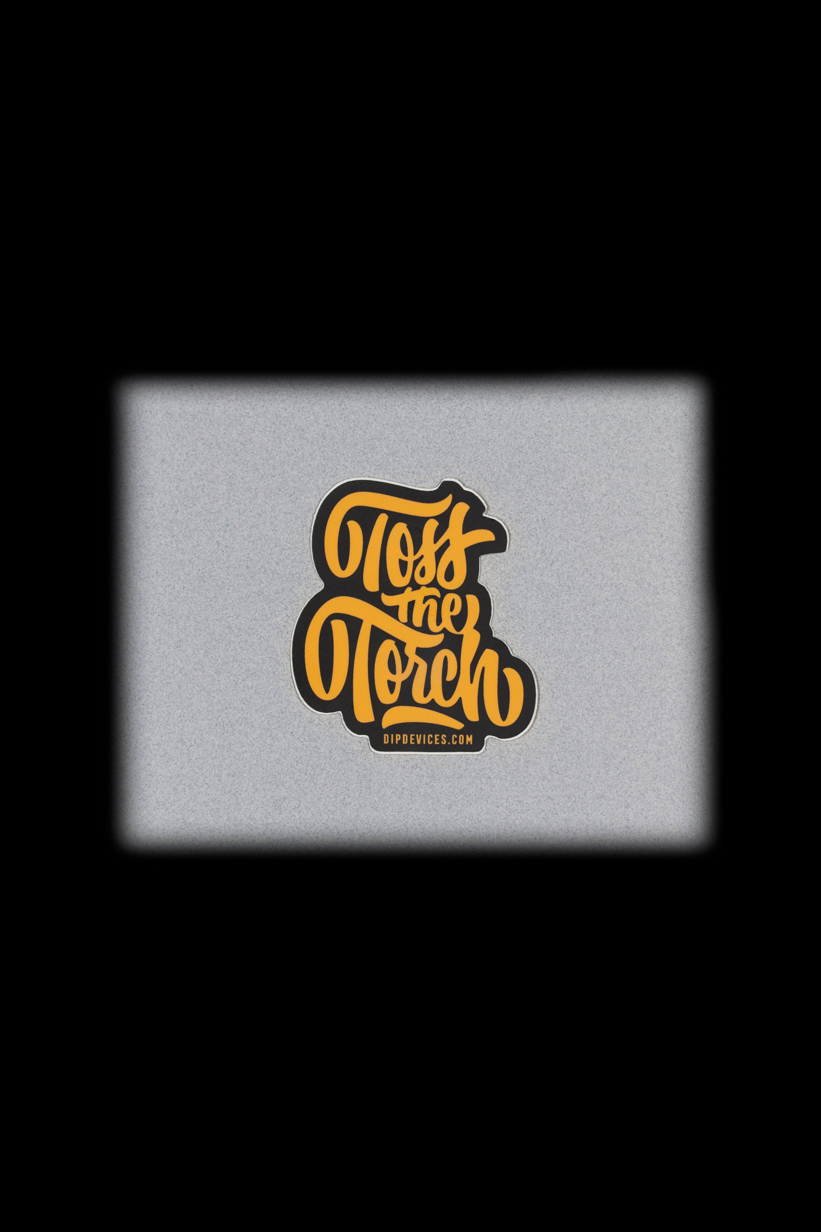 "Pass the Torch" cannabis accessory branding on a textured gray background.