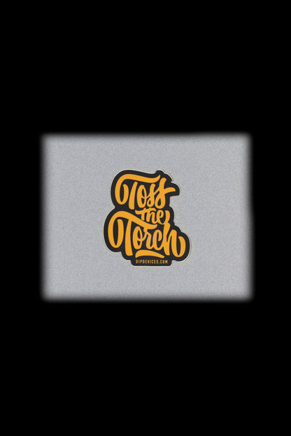 "Pass the Torch" cannabis accessory branding on a textured gray background.
