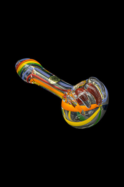 Colorful glass pipe isolated on a black background.