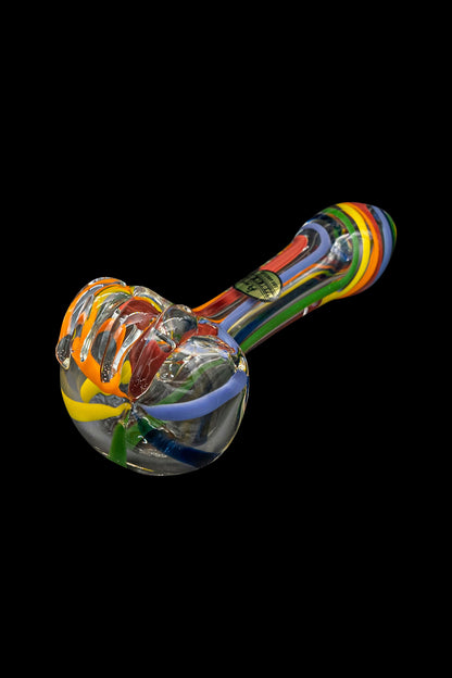 Colorful glass smoking pipe isolated on a black background.