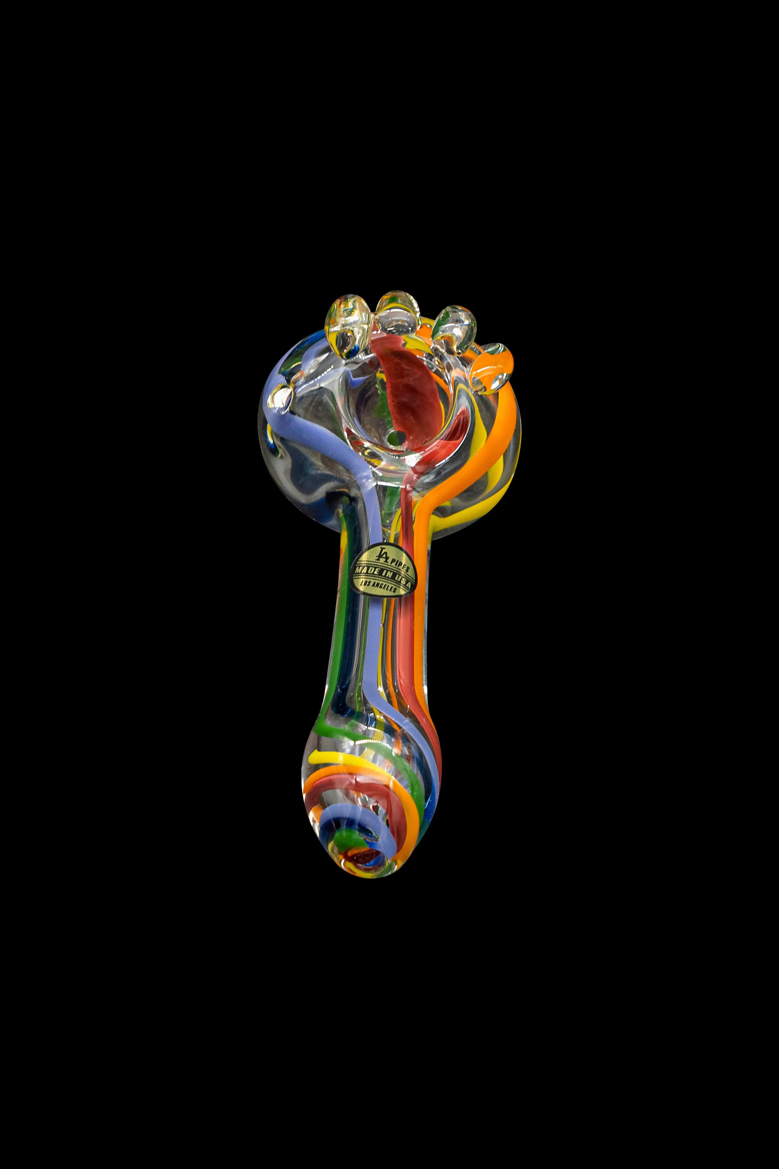 Colorful glass pipe isolated on a black background.