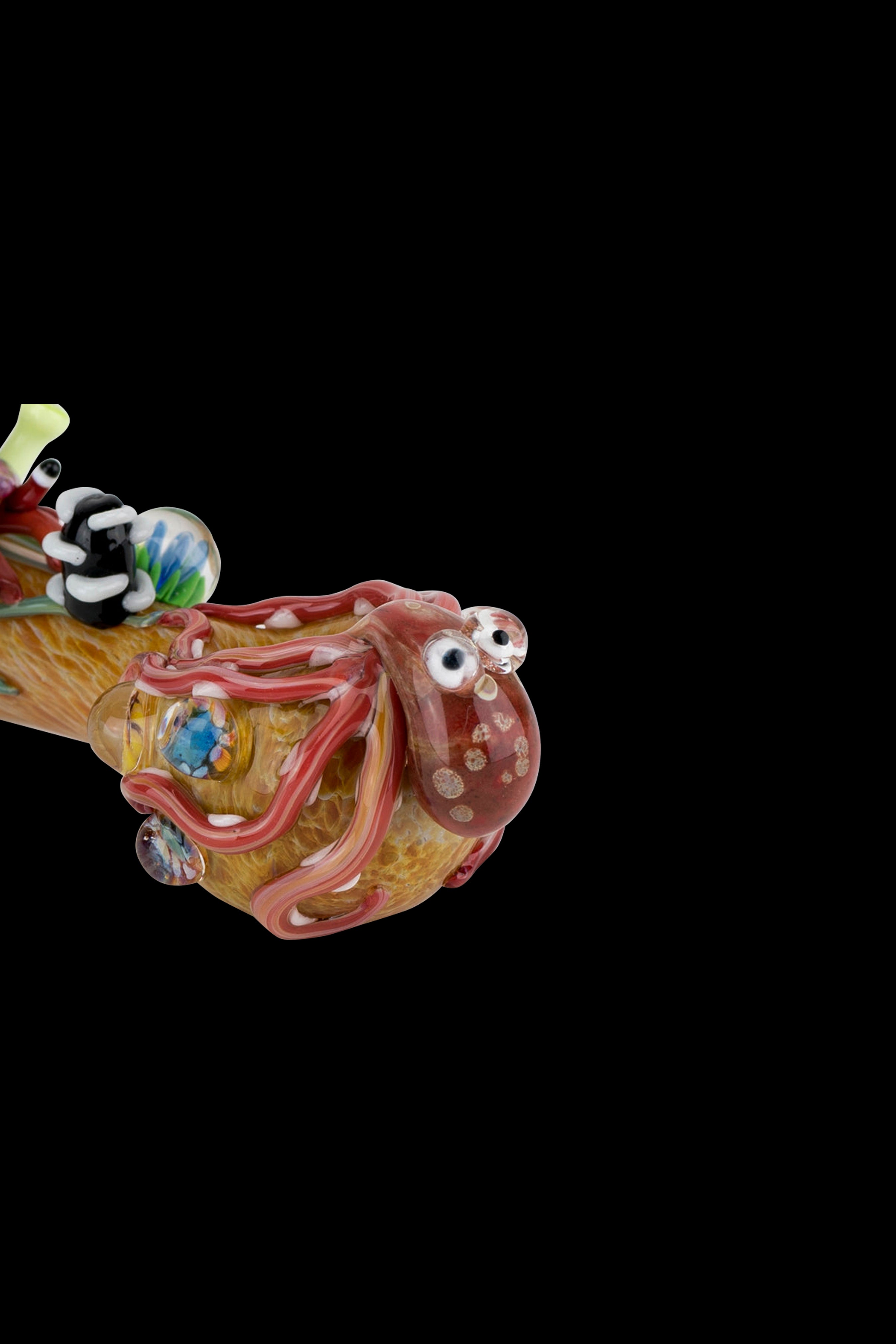 Hand-blown glass pipe sculpted as a whimsical octopus with colorful details, isolated on a black background.