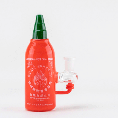 Empire Glassworks Sriracha Sauce Rig – vibrant red glass water pipe shaped like a Sriracha bottle, with clear accents.