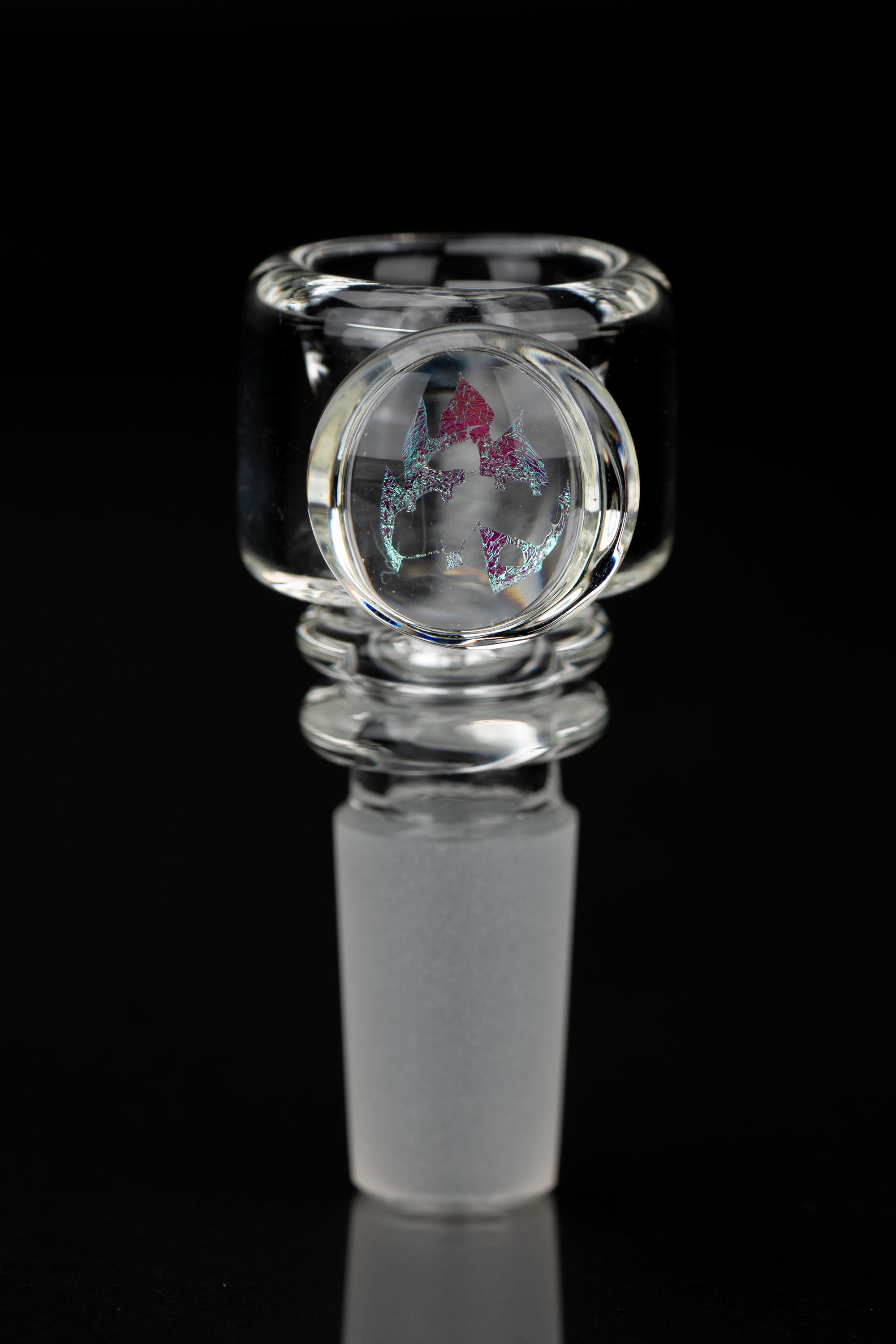 Clear glass cannabis bowl with colorful fractal-like design.