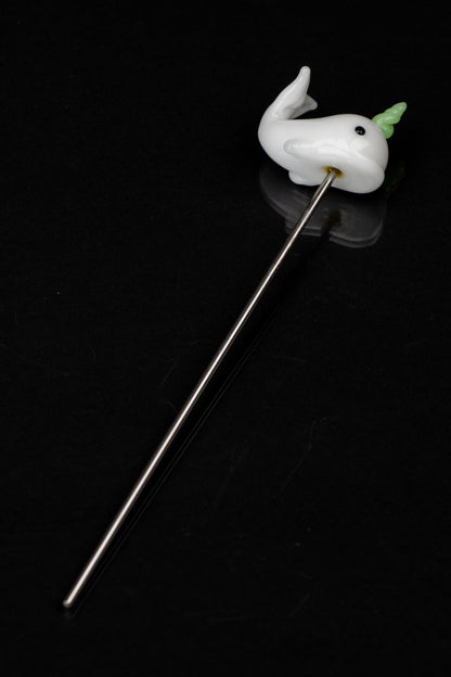 Glass ghost dab tool with green accent on a black background.