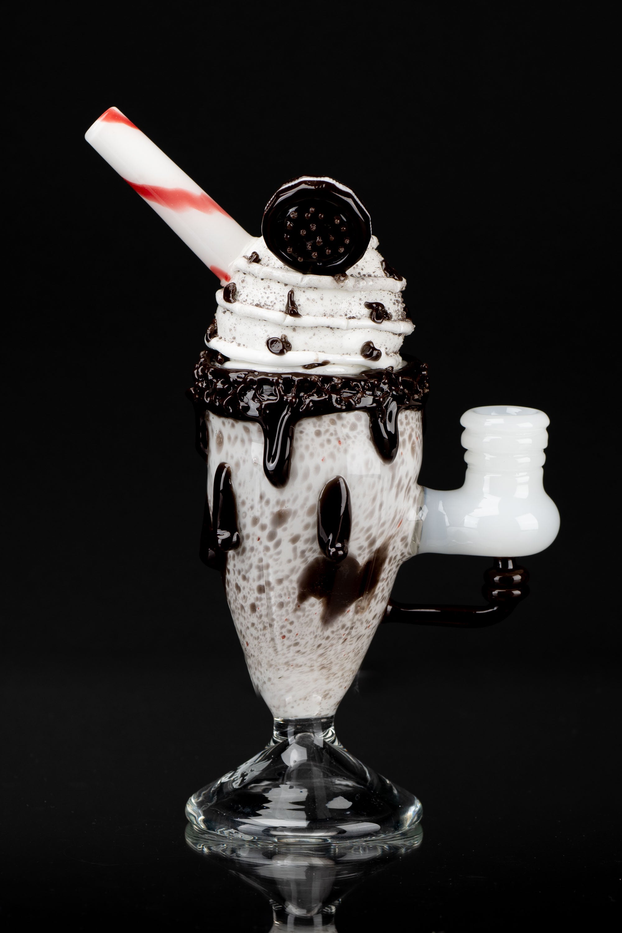 Glass pipe shaped like a chocolate sundae with whipped cream and a cherry on top.