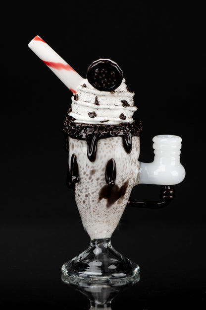 Glass pipe shaped like a chocolate sundae with whipped cream and a cherry on top.