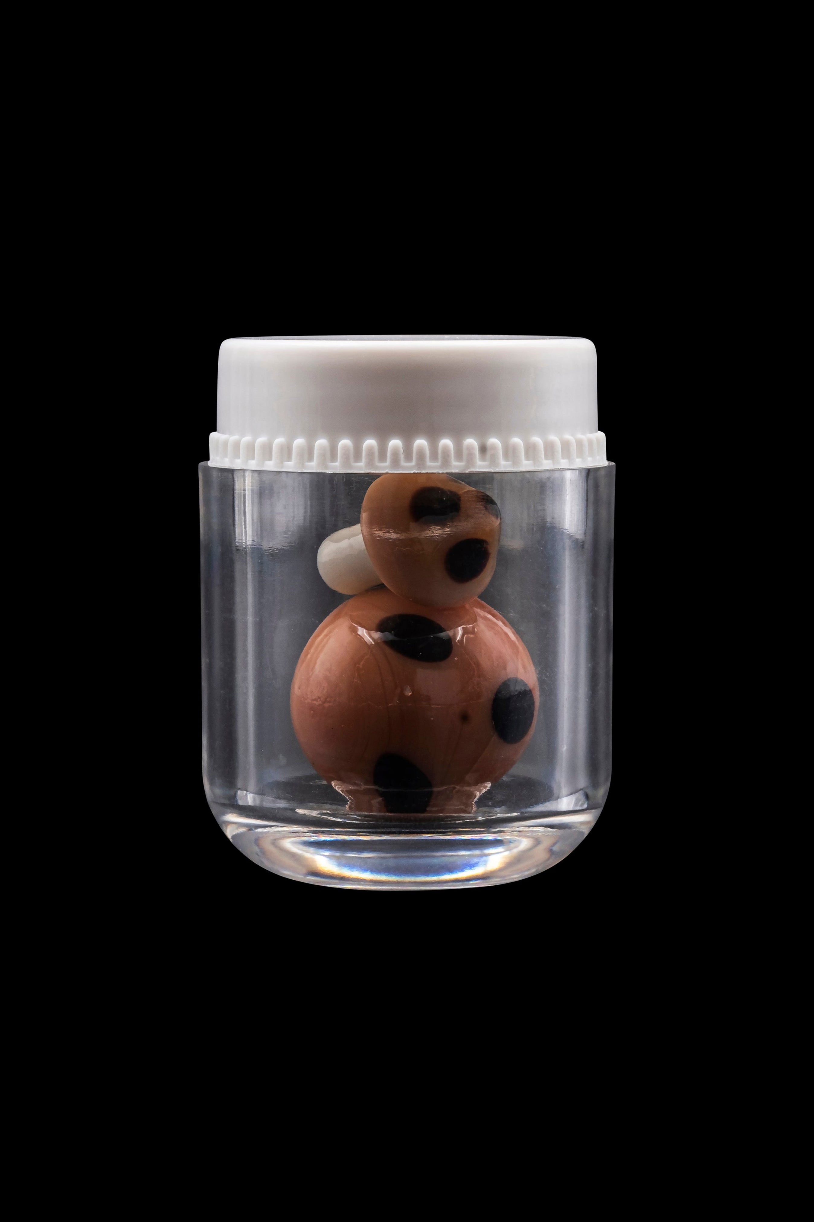 Glass cannabis bubbler in a clear storage jar against a black background.