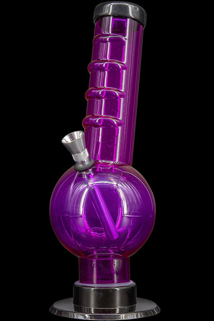 Purple glass water pipe with metallic accents.