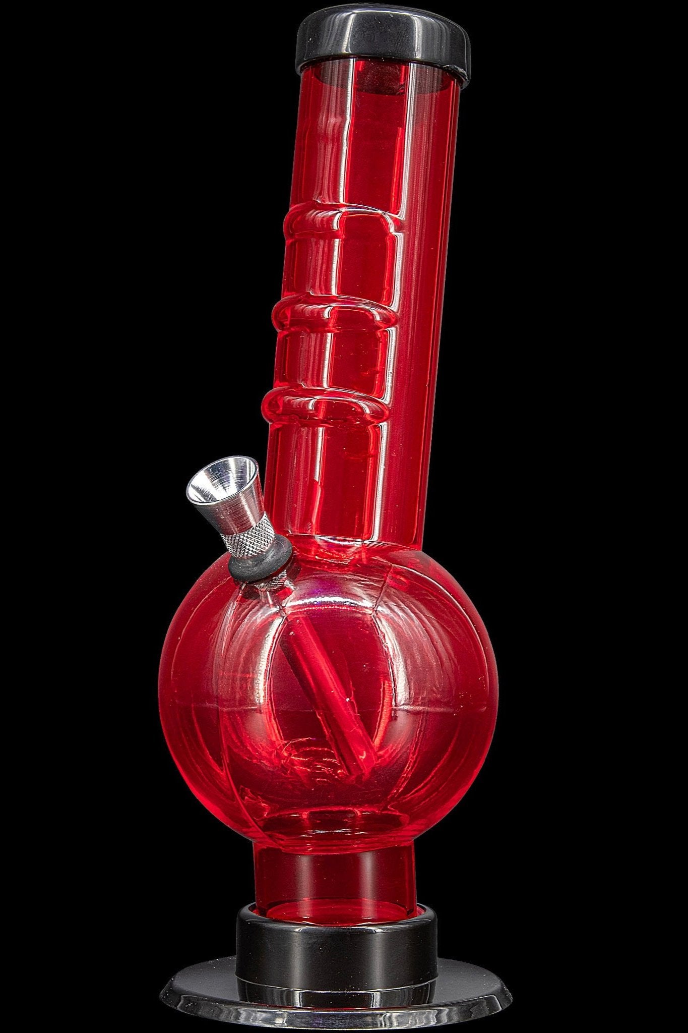 Red glass water pipe (bong) against a black background.