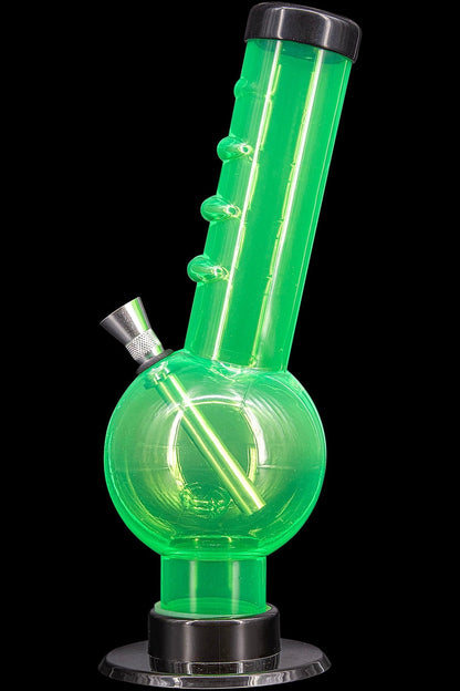 Green glass water pipe (bong) isolated on black.