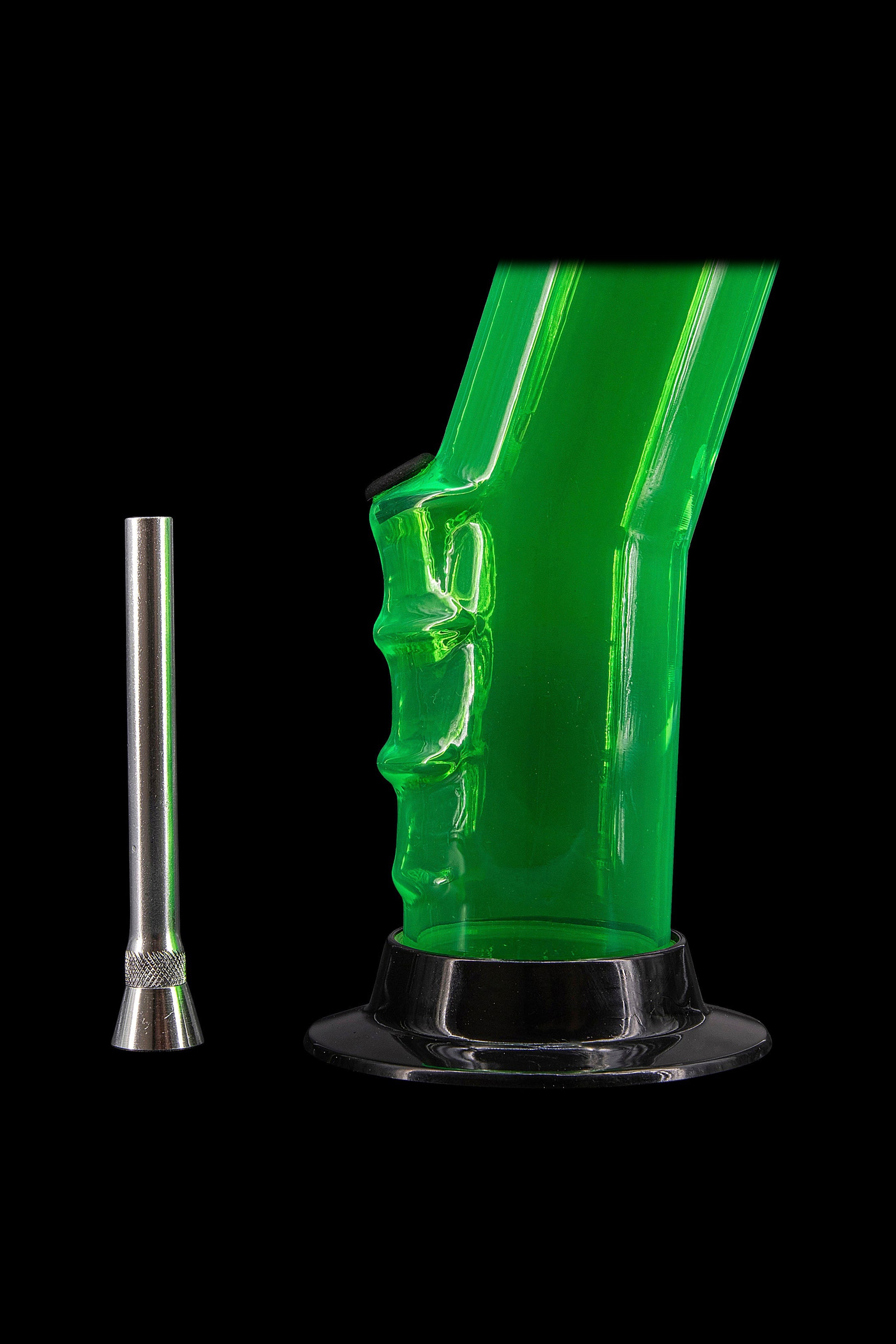 Green glass water pipe (bong) with a metal downstem, isolated on a black background.