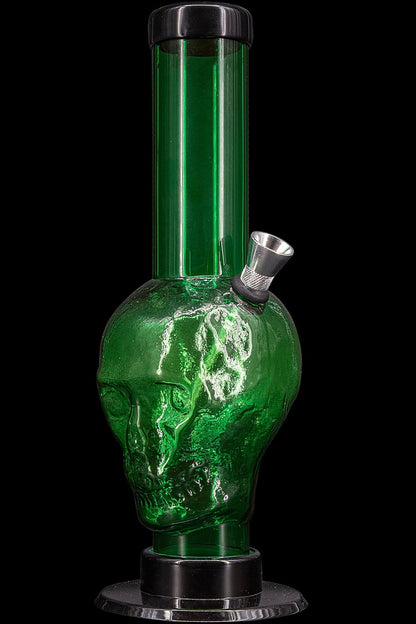 Green glass water pipe shaped like a skull.