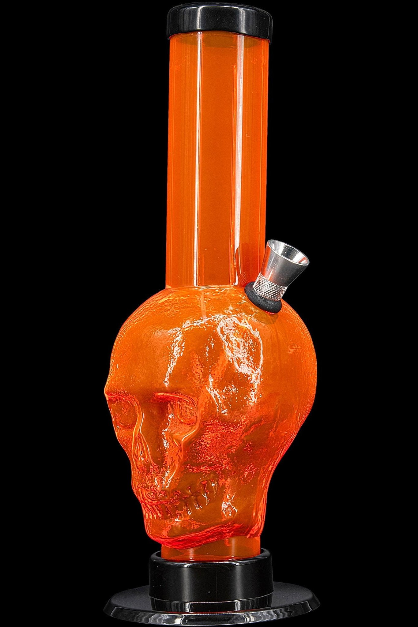 Orange glass water pipe with a sculpted skull design.