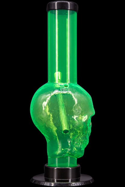 Green glass water pipe shaped like a skull.