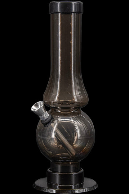 Smoked glass water pipe (bong) with a wide base and narrow neck.