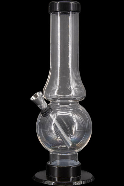 Clear glass water pipe (bong) with a downstem and base, isolated on a black background.