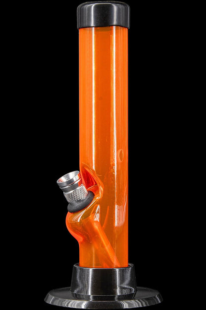 Orange glass water pipe with metal accents against a black background.