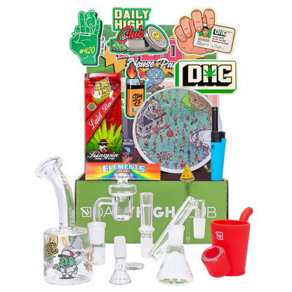Front view of the “420 House Party” Smoking Box showing stickers, rolling papers, a blue lighter and glass accessories arranged against a green branded backdrop