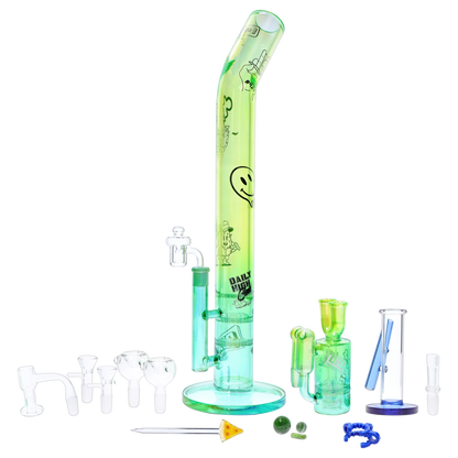 Straight-on shot of the green “Epic 420 House Party” Deluxe Box set arranged with a tall bent-tube bong center and multiple clear and green glass accessories laid out around it.