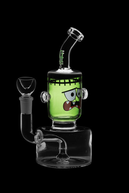 Green glass water pipe shaped like Frankenstein's monster with a clear glass bowl.