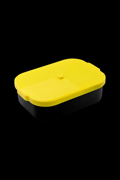 Yellow and black smell-proof container, likely for cannabis storage.