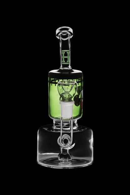 Green glass water pipe (rig) with percolator, isolated on black.