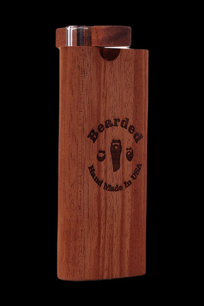 Wooden one-hitter pipe with “Bearded Hand Made in USA” logo against a black background.