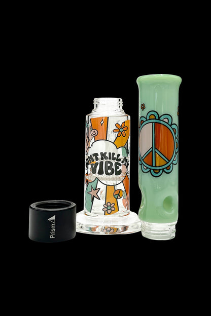 A vibrant glass water pipe with a retro peace sign and floral design, alongside a black airtight container labeled "Prism."