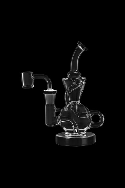 Clear glass dab rig with intricate curves and a quartz banger, isolated on a black background.