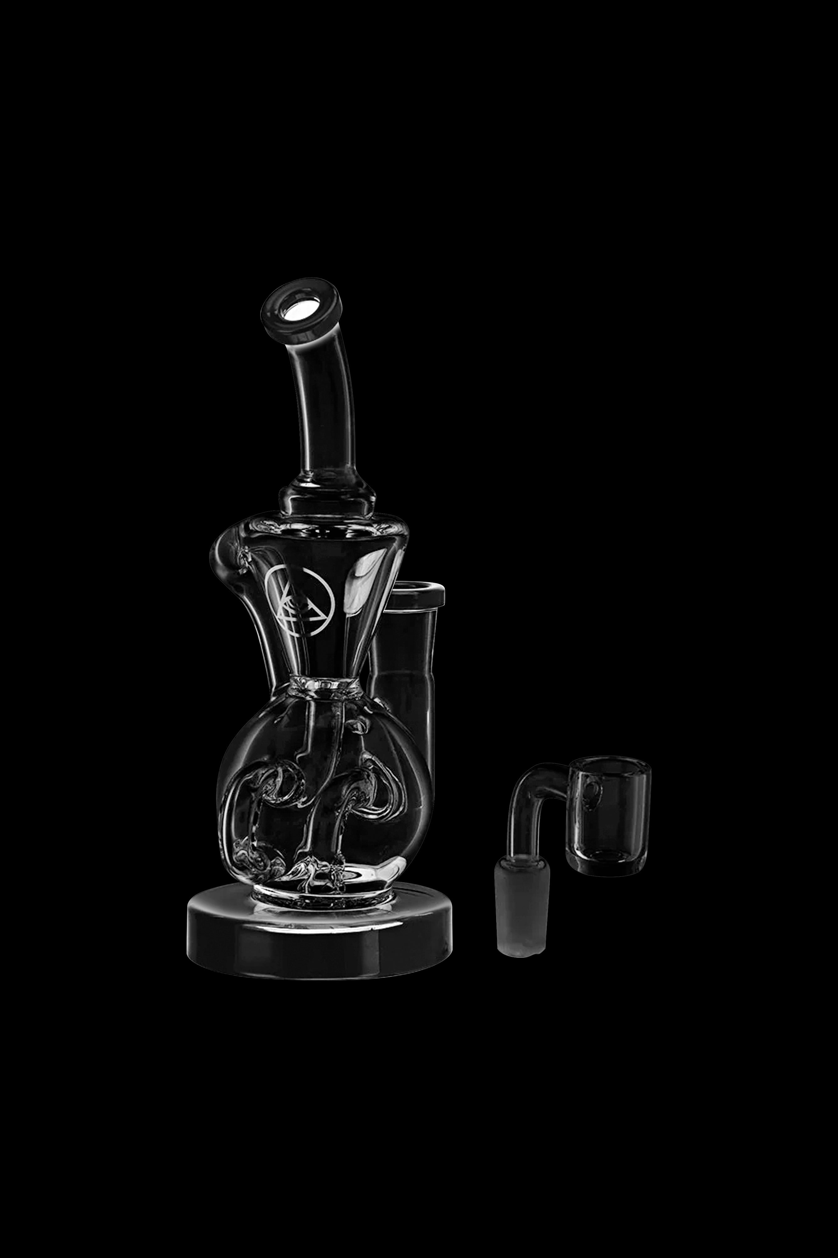 Clear glass bubbler water pipe with accompanying glass downstem, isolated on a black background.