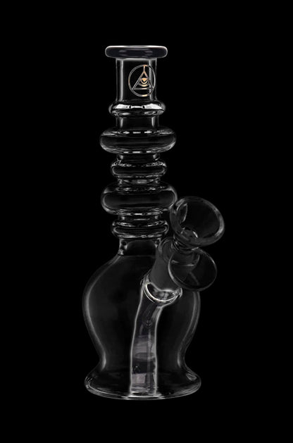 Clear glass water pipe (rig) with intricate design and bubbler, isolated on a black background.