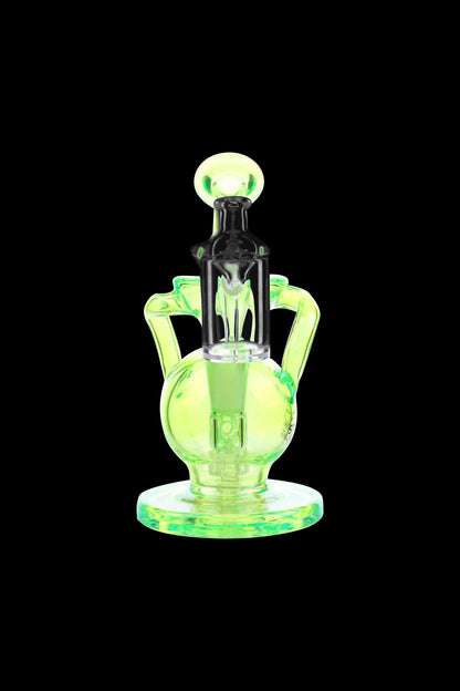 Green glass rig with intricate bubbler and mouthpiece.