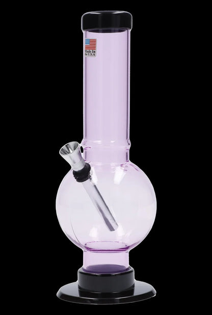 Pink glass water pipe with a flared base and clear glass downstem, labeled "Made in the U.S.A."
