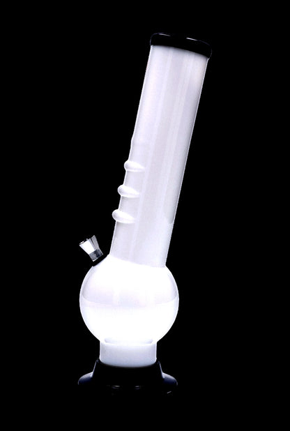 Angled studio shot of the Acrylic Bong 2" ACRYLICS in glossy white with a rounded base, ridged neck grips, and black rim against a black background