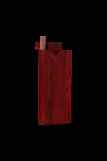 Red wooden one-hitter pipe with a wooden bowl insert, isolated on a black background.