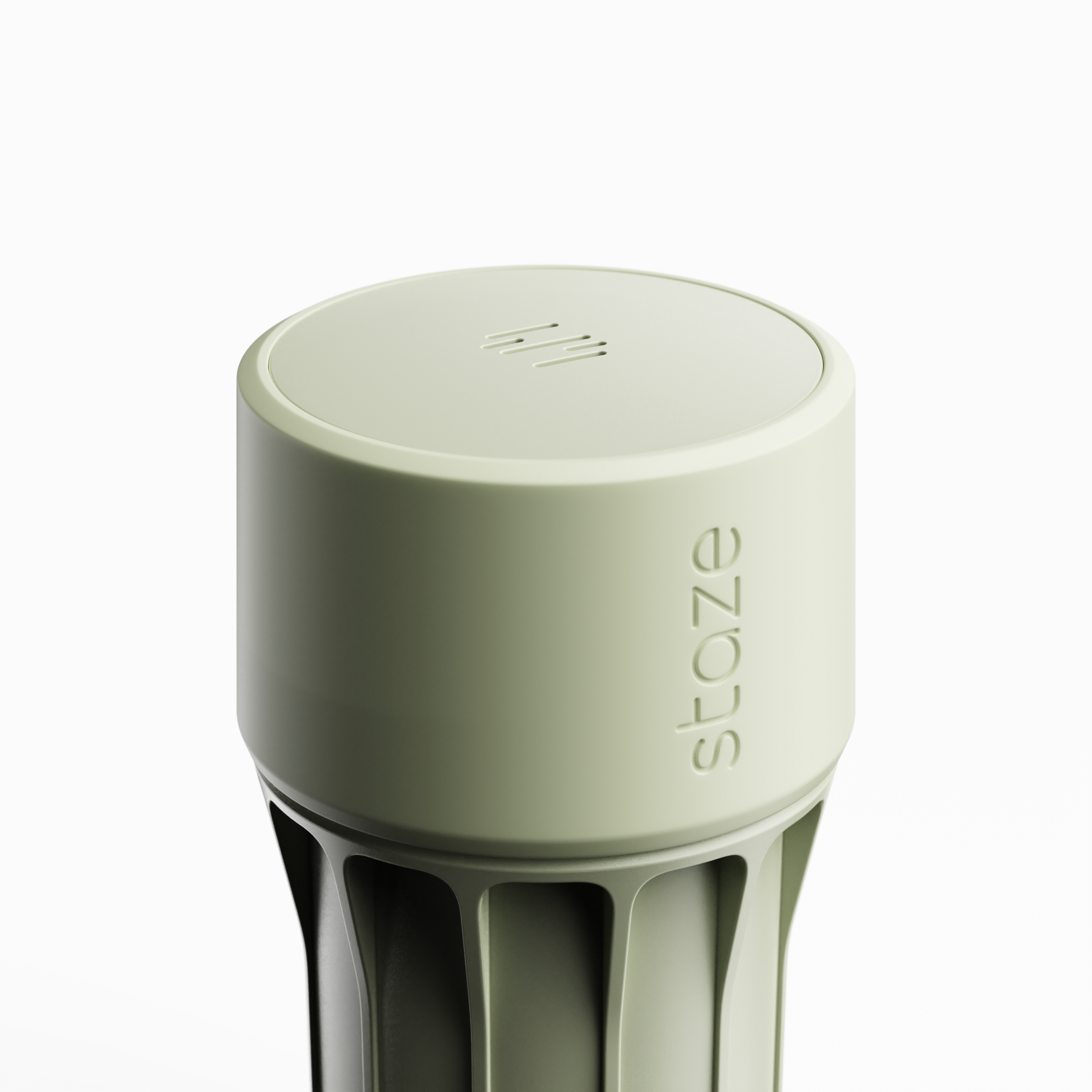 Close-up, slightly overhead view of the pale green STAZE PRESERVE showing its rounded top with vent slits and embossed side logo.