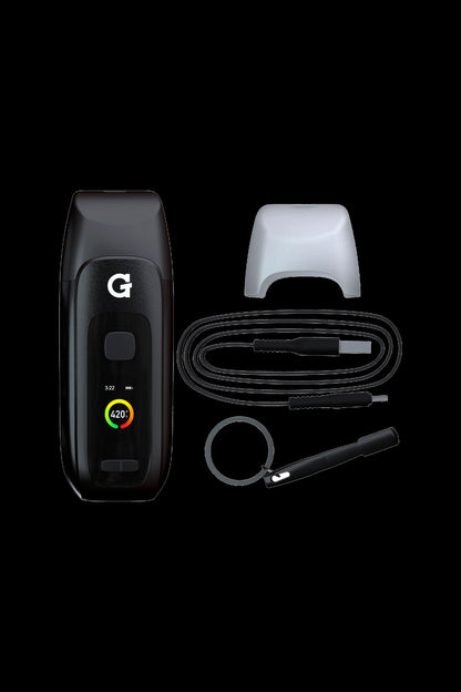 Black cannabis vaporizer device and accessories laid out on a dark background.